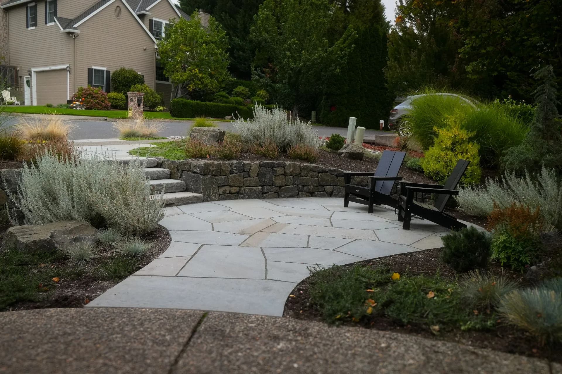 Front Yard Flagstone Patio and Stone Retaining Wall Done Right image