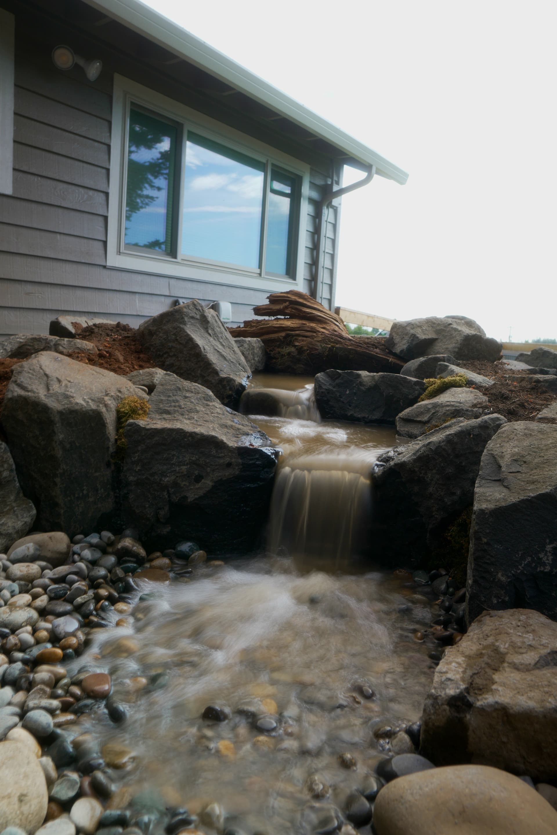 Pondless Water Feature Tucked Right Beside the Patio image