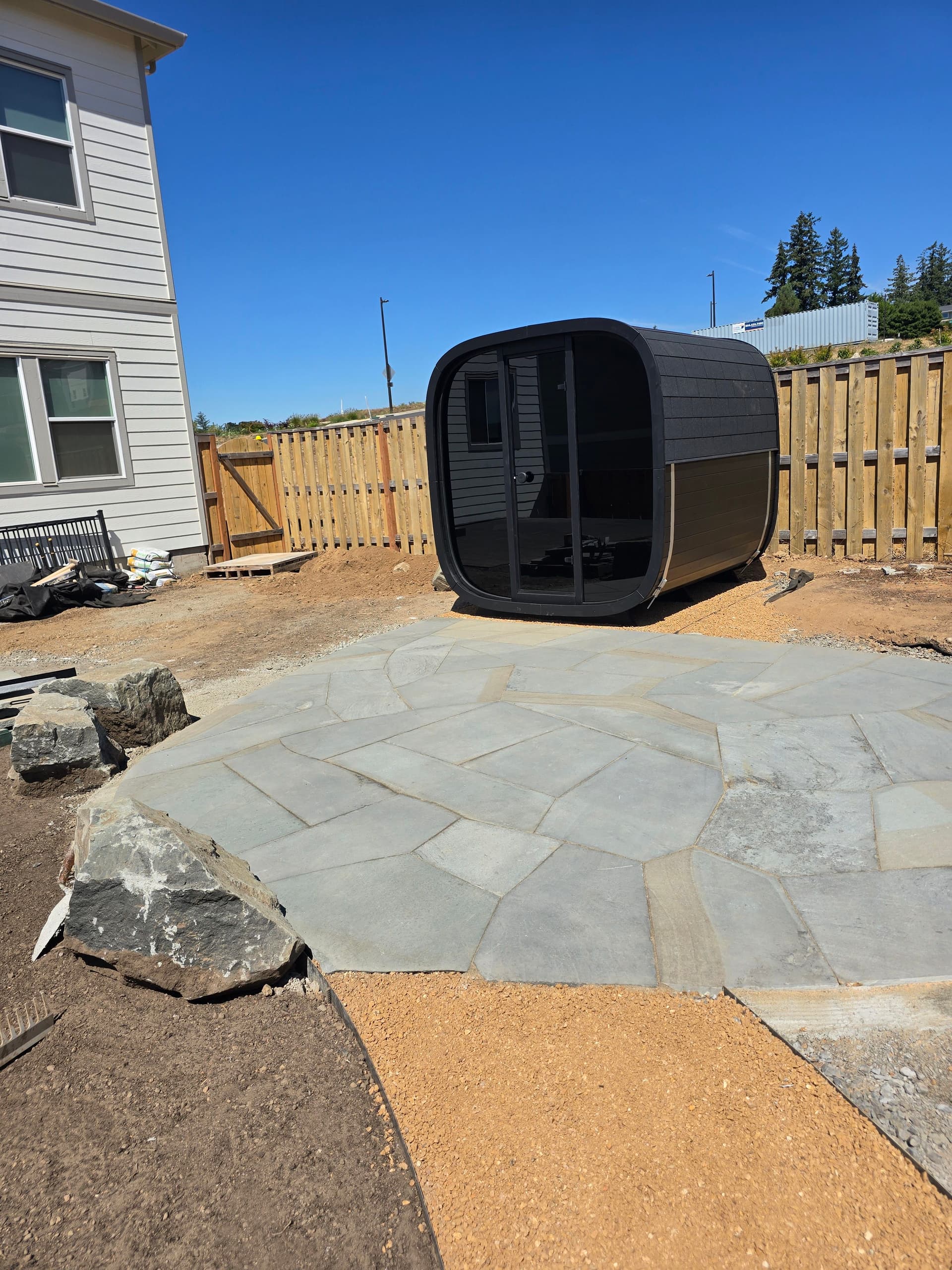 Flagstone Patio and Sauna Combo Taking Shape in the Backyard image