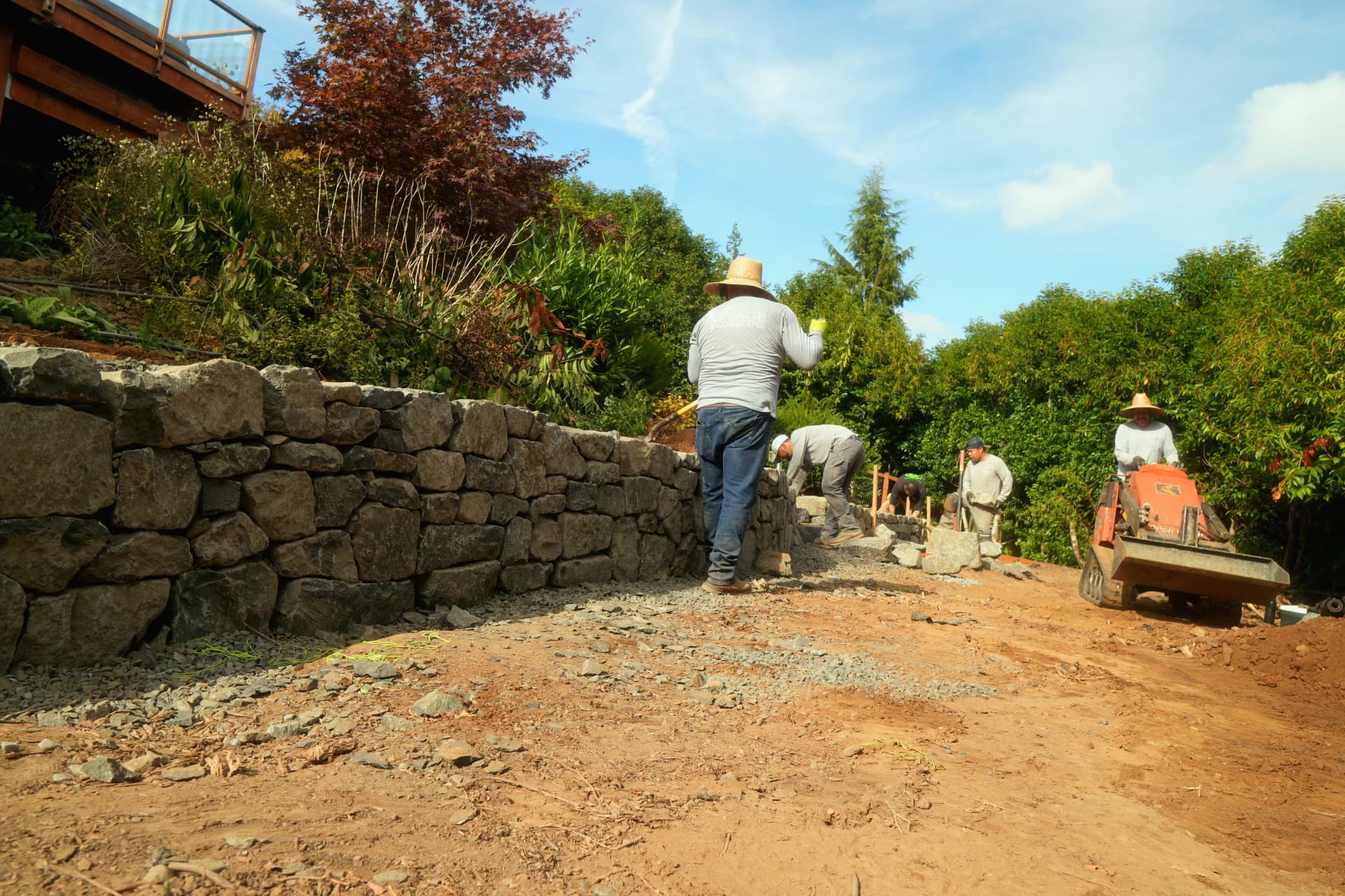 Dry Stack Stone Retaining Walls That Turn Slopes Into Usable Space image